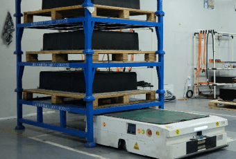 Automated guided vehicle moving battery racks